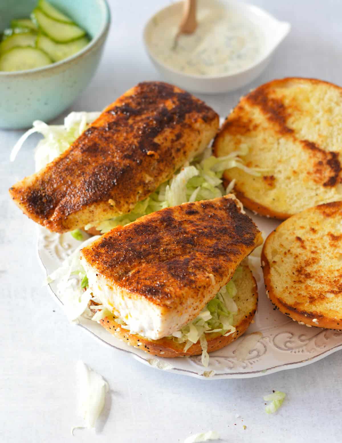 toasted buns with shredded lettuce and blackened mahi mahi.