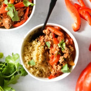 quinoa and cooked ground turkey in a bowl with cilantro