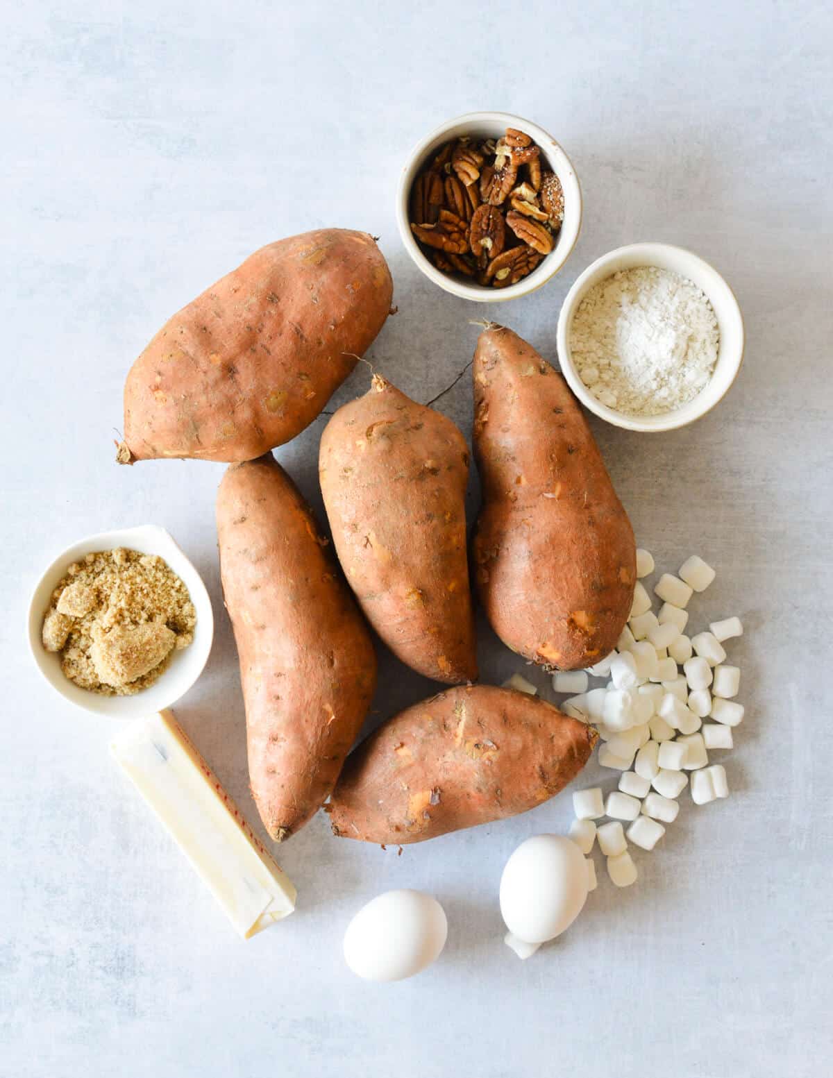 sweet potatoes, pecans, flour, brown sugar, butter, eggs, marshmallows. 