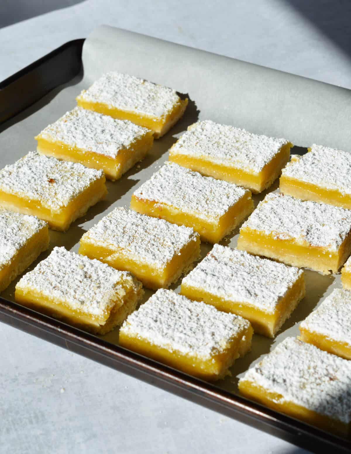 key lime bars on a sheet pan. 