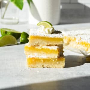 a stack of gluten free key lime bars.