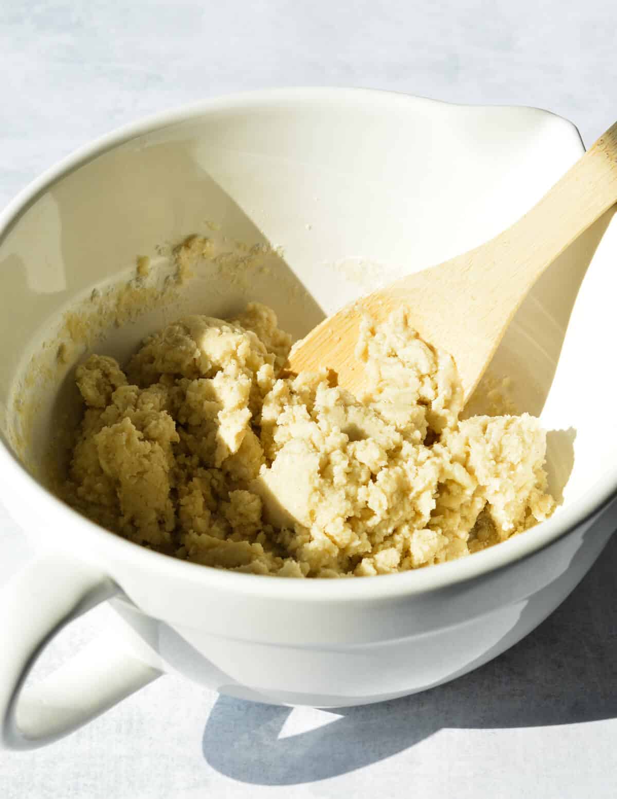 a bowl of gluten free shortbread dough.