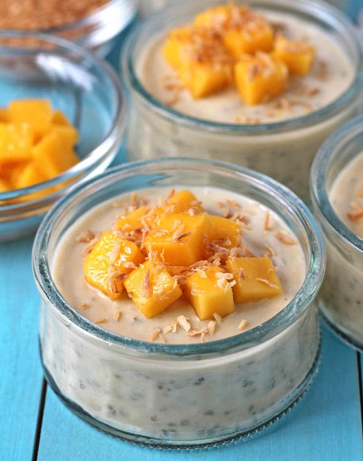 chia pudding with chopped mango and coconut on top. 