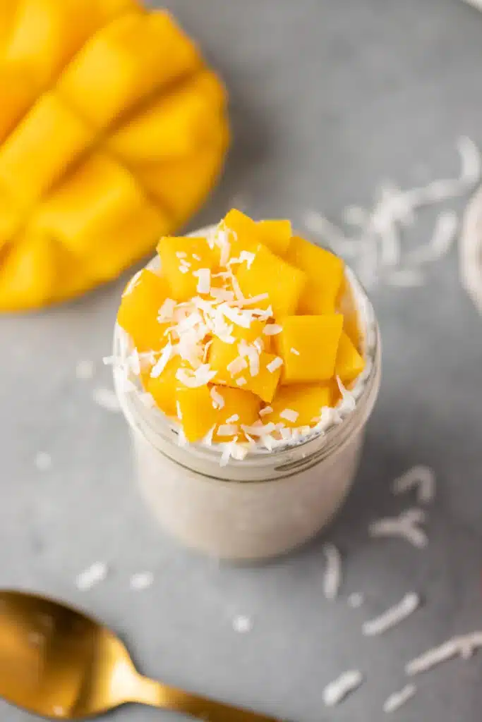 overnight oats with mango chunks and coconut on top. 