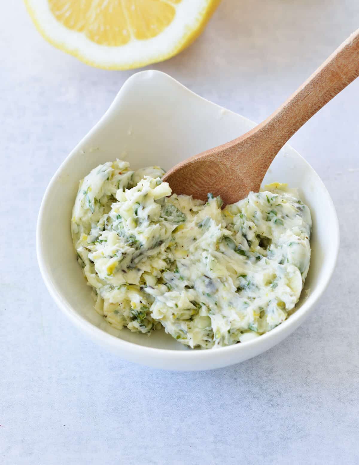 a small bowl of lemon herb butter.