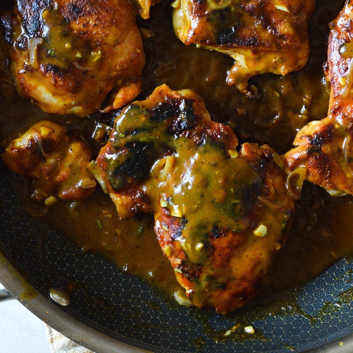 Sweet and Tangy Mustard Chicken Thighs caramel and cashews