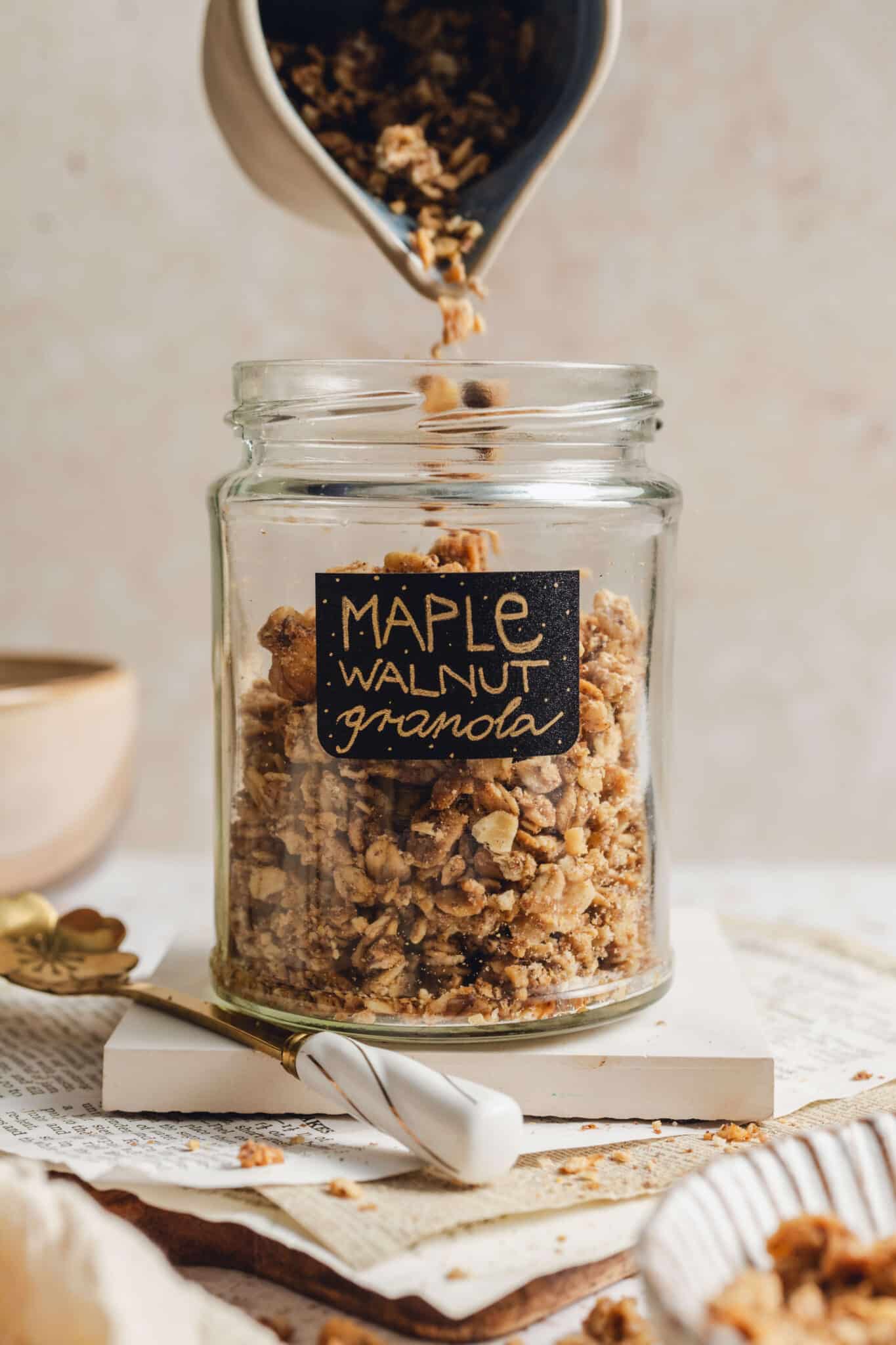 a jar full of maple walnut granola.