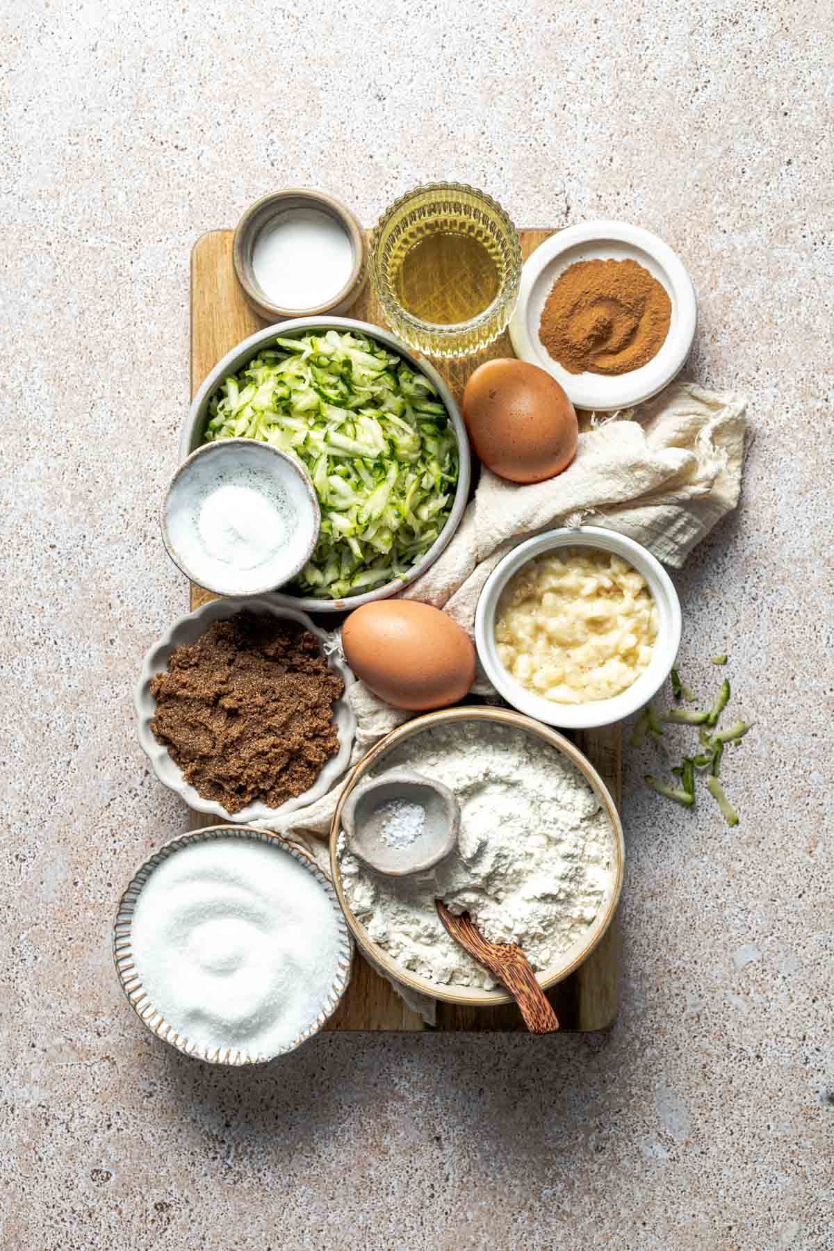 vegetable oil, grated zucchini, cinnamon, eggs, mashed banana, brown sugar, flour, sugar, all-purpose flour, and salt. 