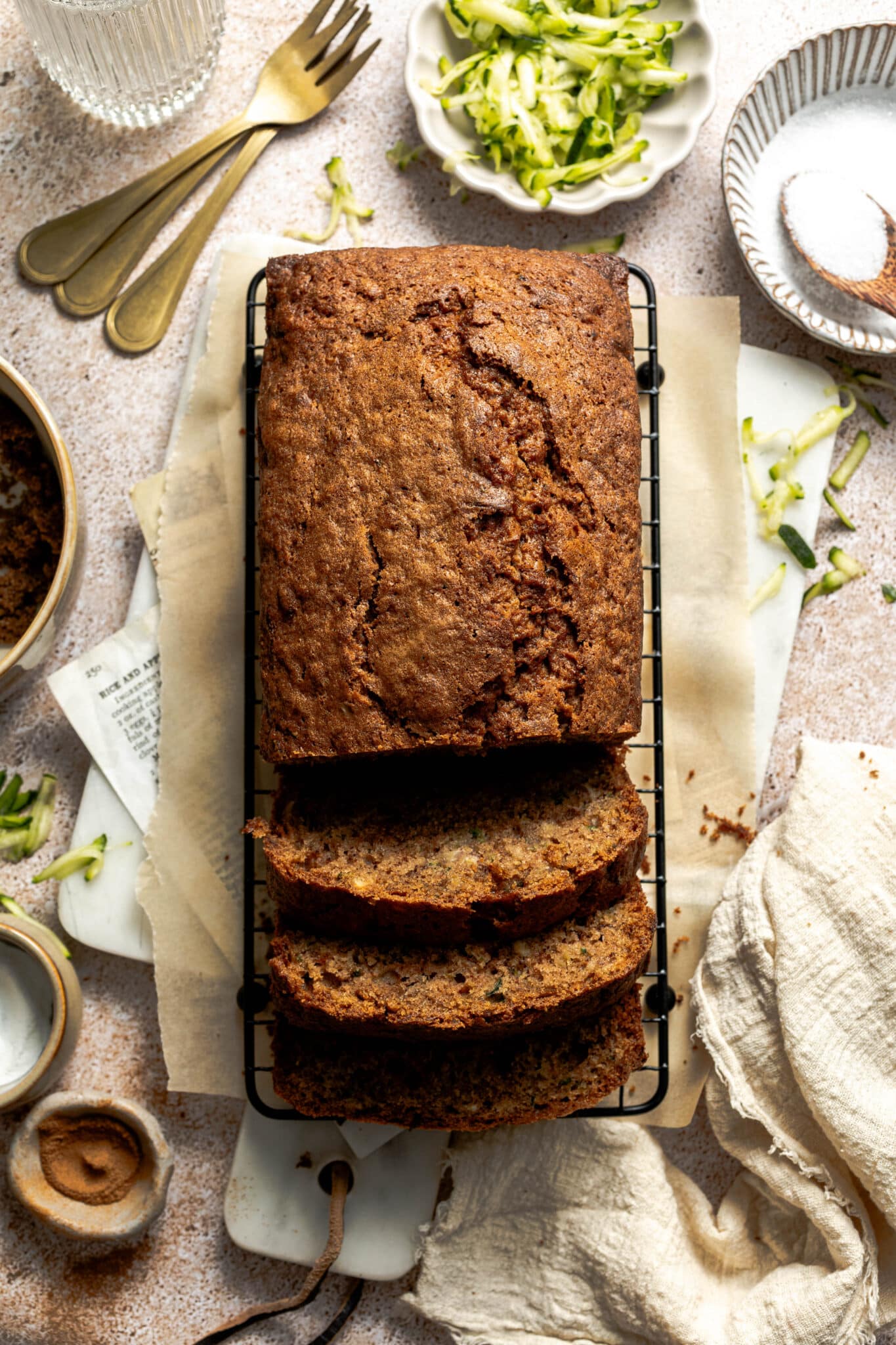 sliced gluten free zucchini bread on a wire rack.