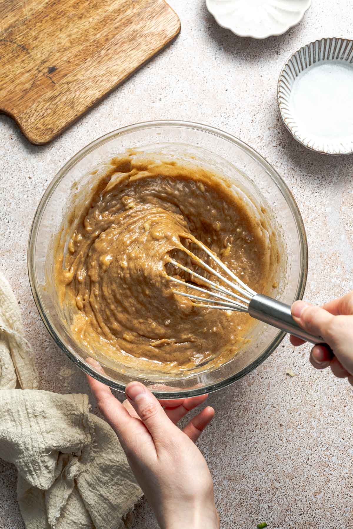 whisking batter in a bowl.