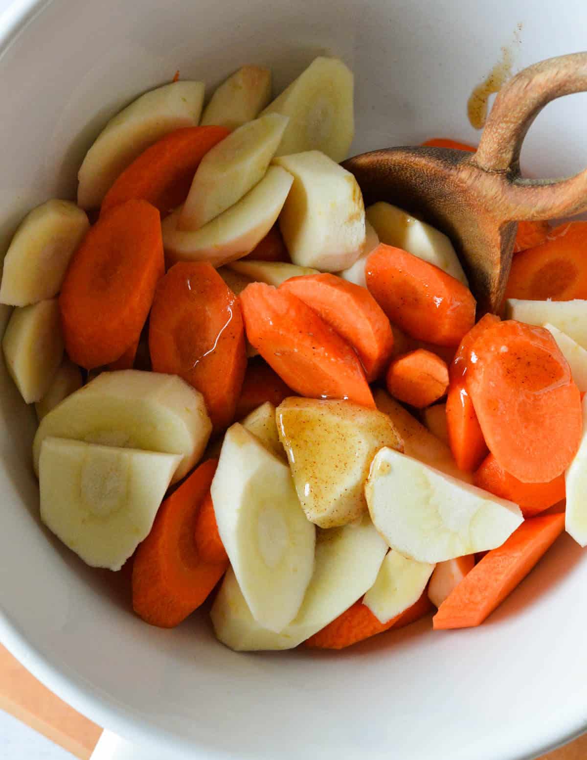 sliced carrots and parsnips with honey mixture on top.