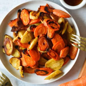 a plate of honey roasted carrots and parsnips.
