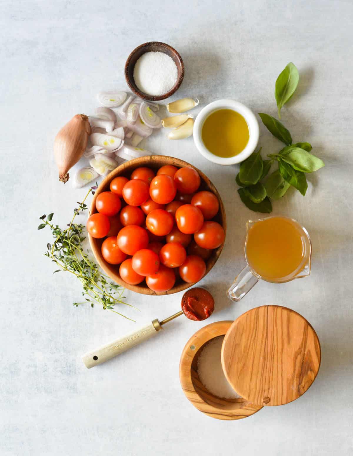 sugar, shallots, olive oil, basil, garlic, olive oil, vegetable stock, thyme, salt, and tomato paste.