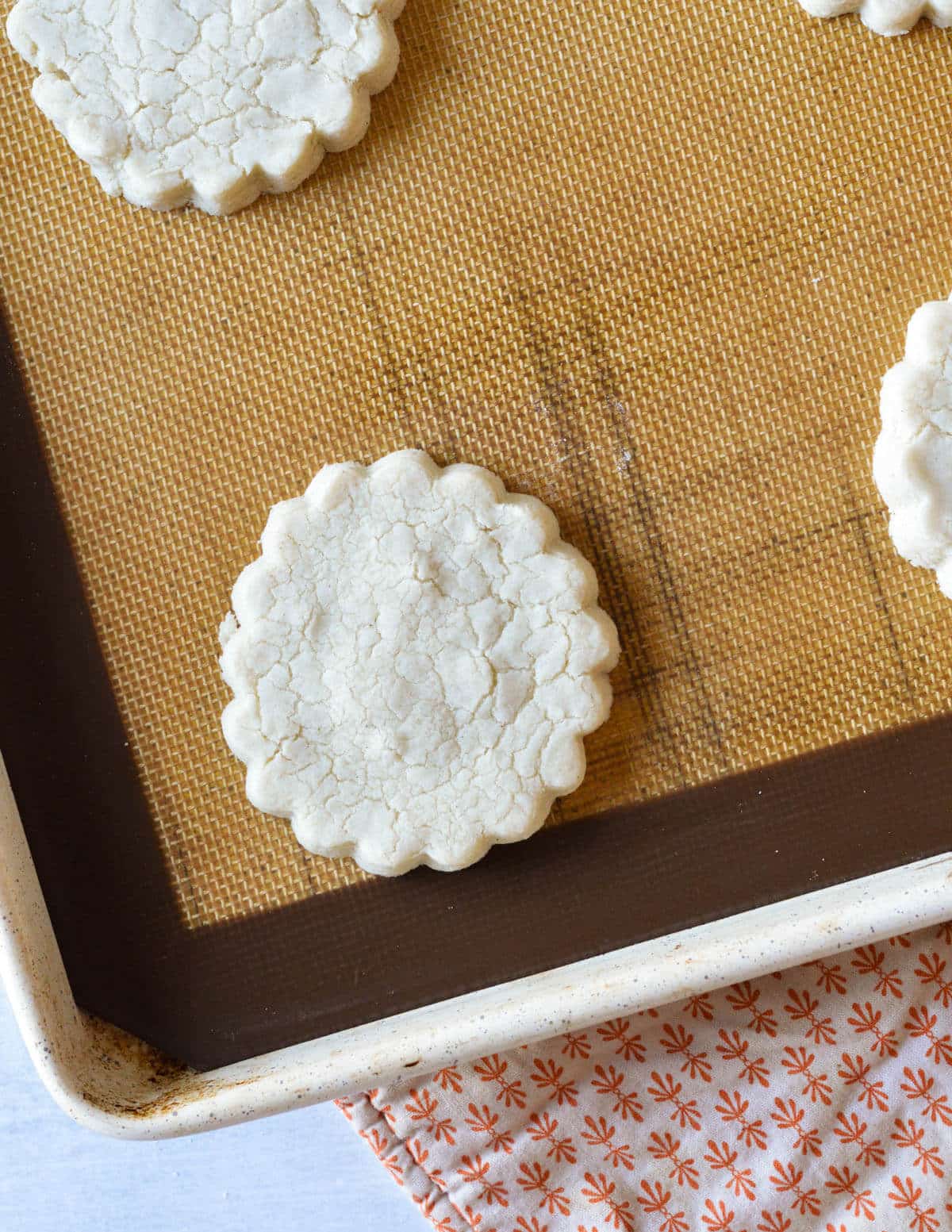 baked gluten free shortbread cookie on a sheet pan.
