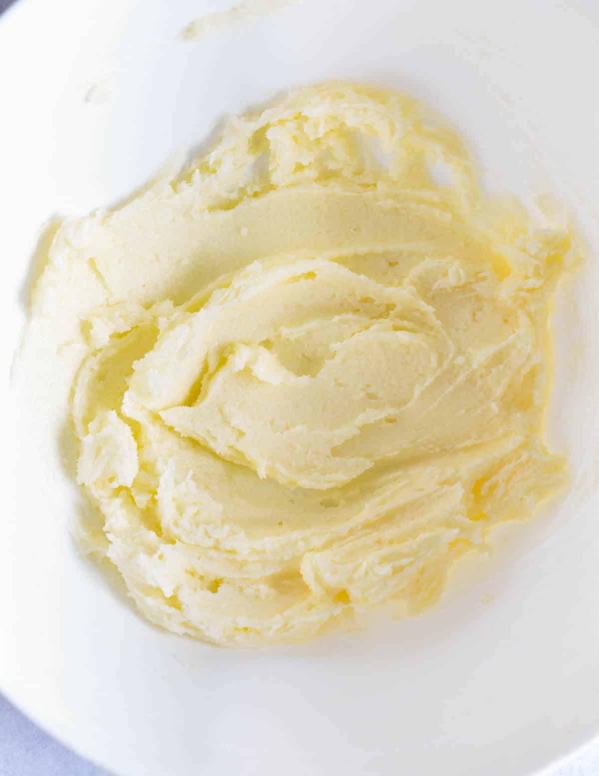 a bowl of creamed butter and sugar,