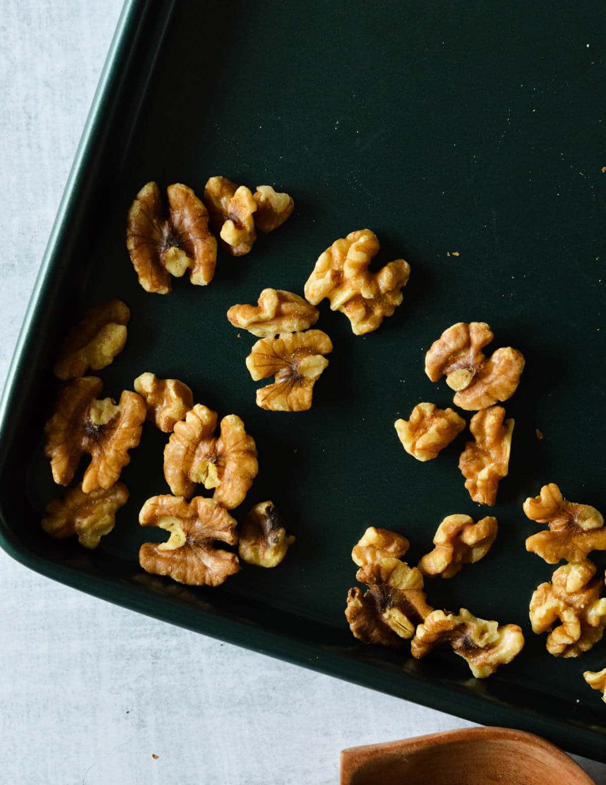 raw walnuts on a sheet pan.