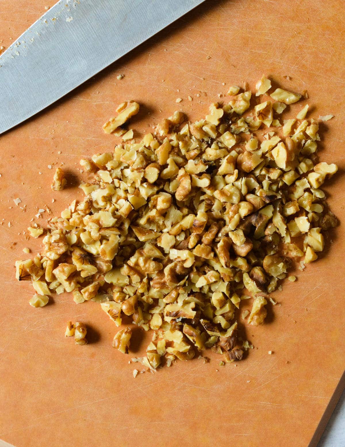 chopped walnuts on a cutting board.