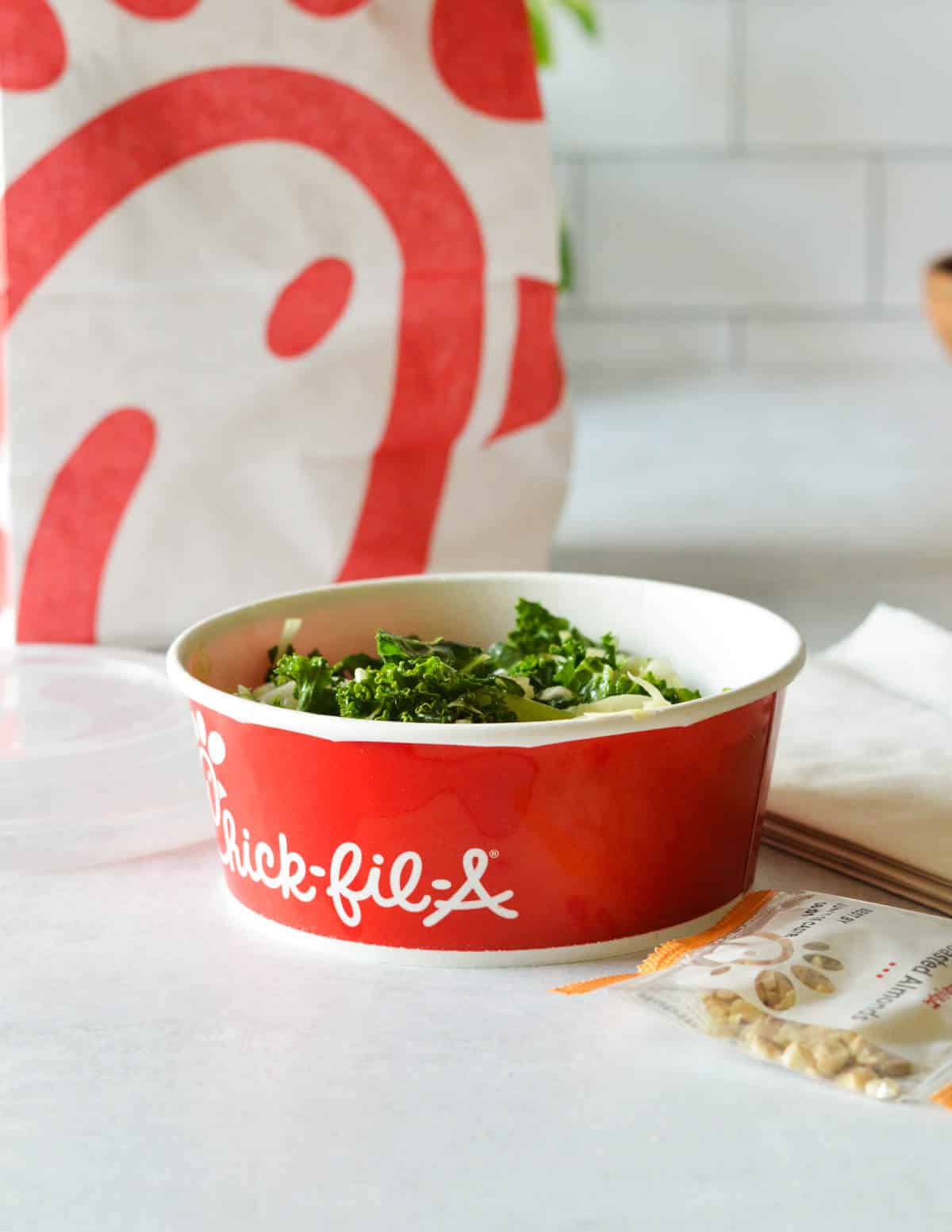 kale salad in a red Chick-Fil-A cup