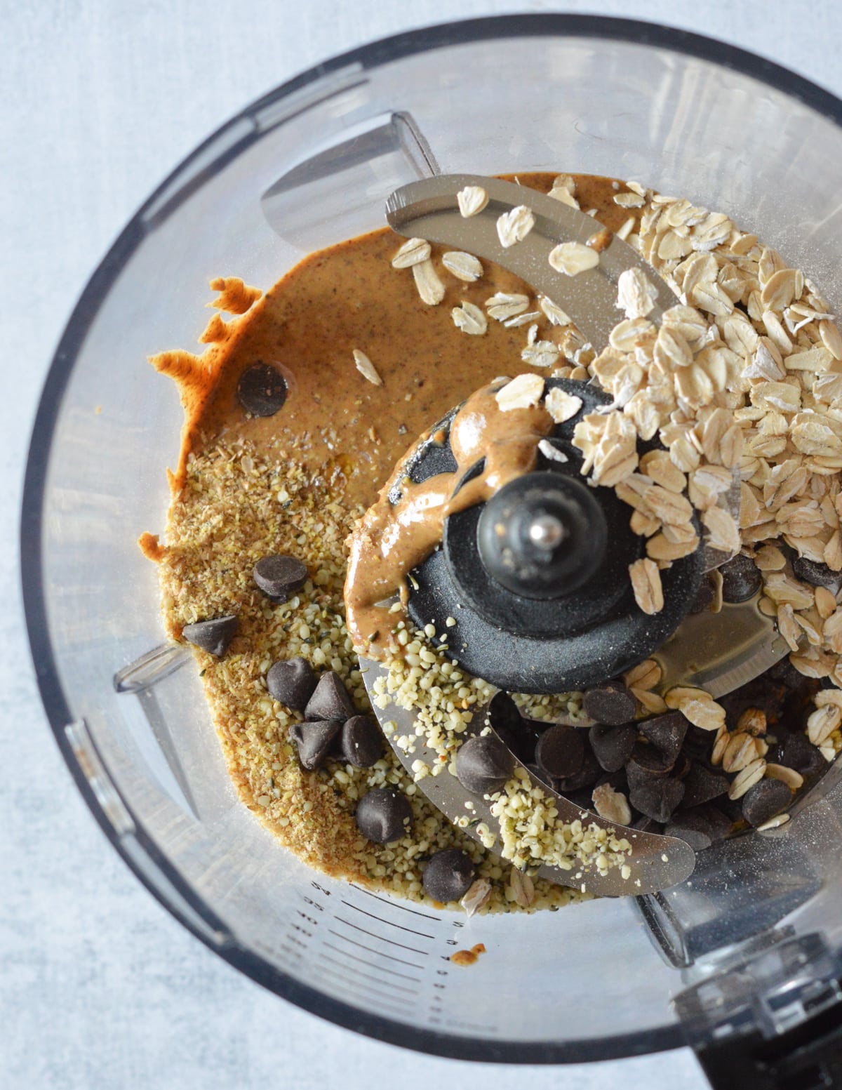 almond butter, oats, hemp hearts, chocolate chips, and flax meal in a food processor.