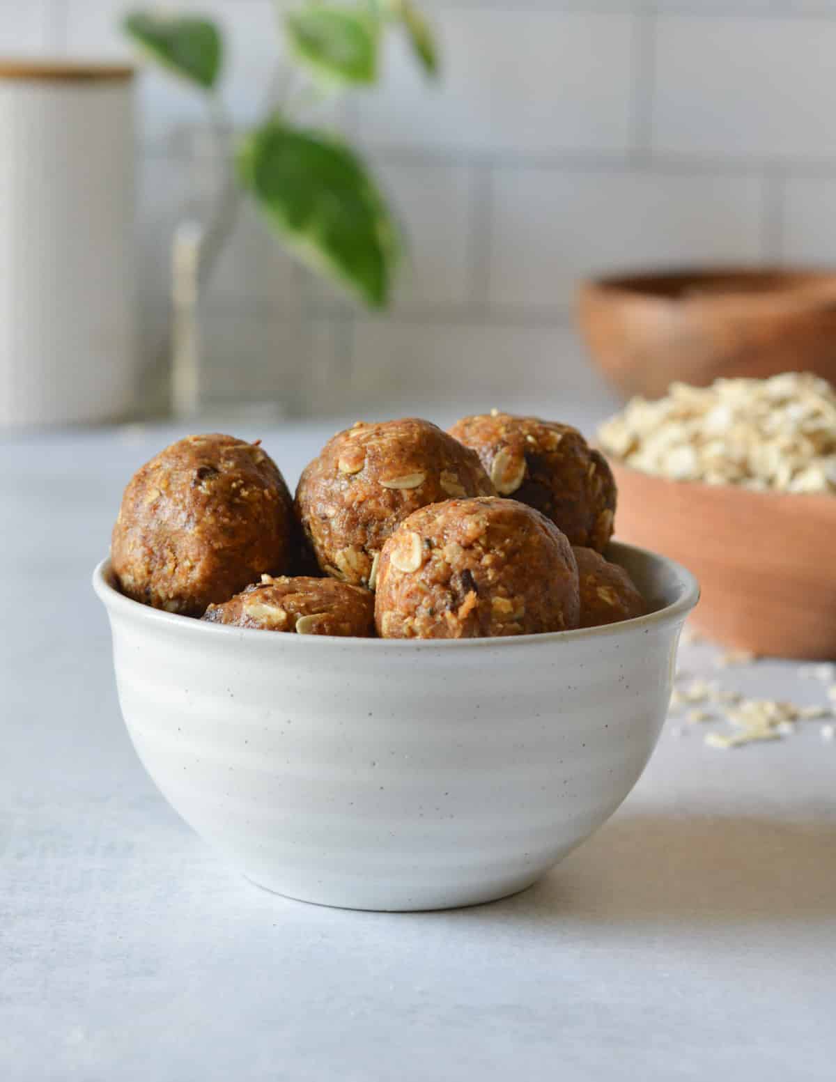 a bowl of almond butter balls