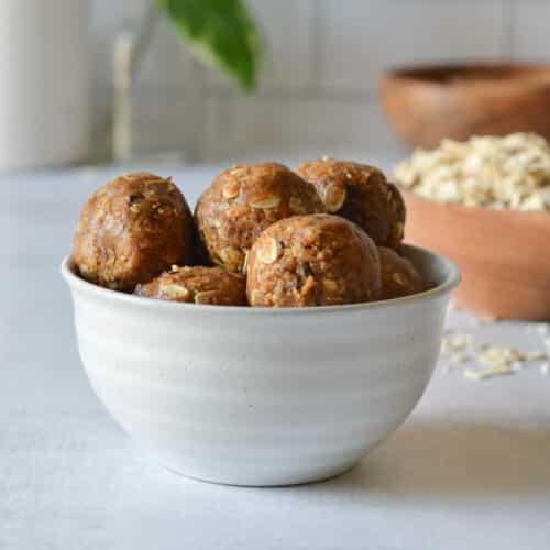 a bowl of almond butter energy balls.