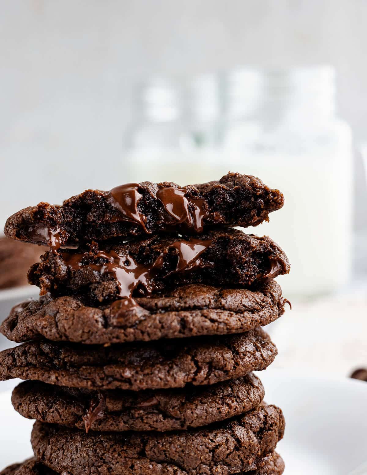 a stack of double chocolate cookies with melted chocolate oozing out.
