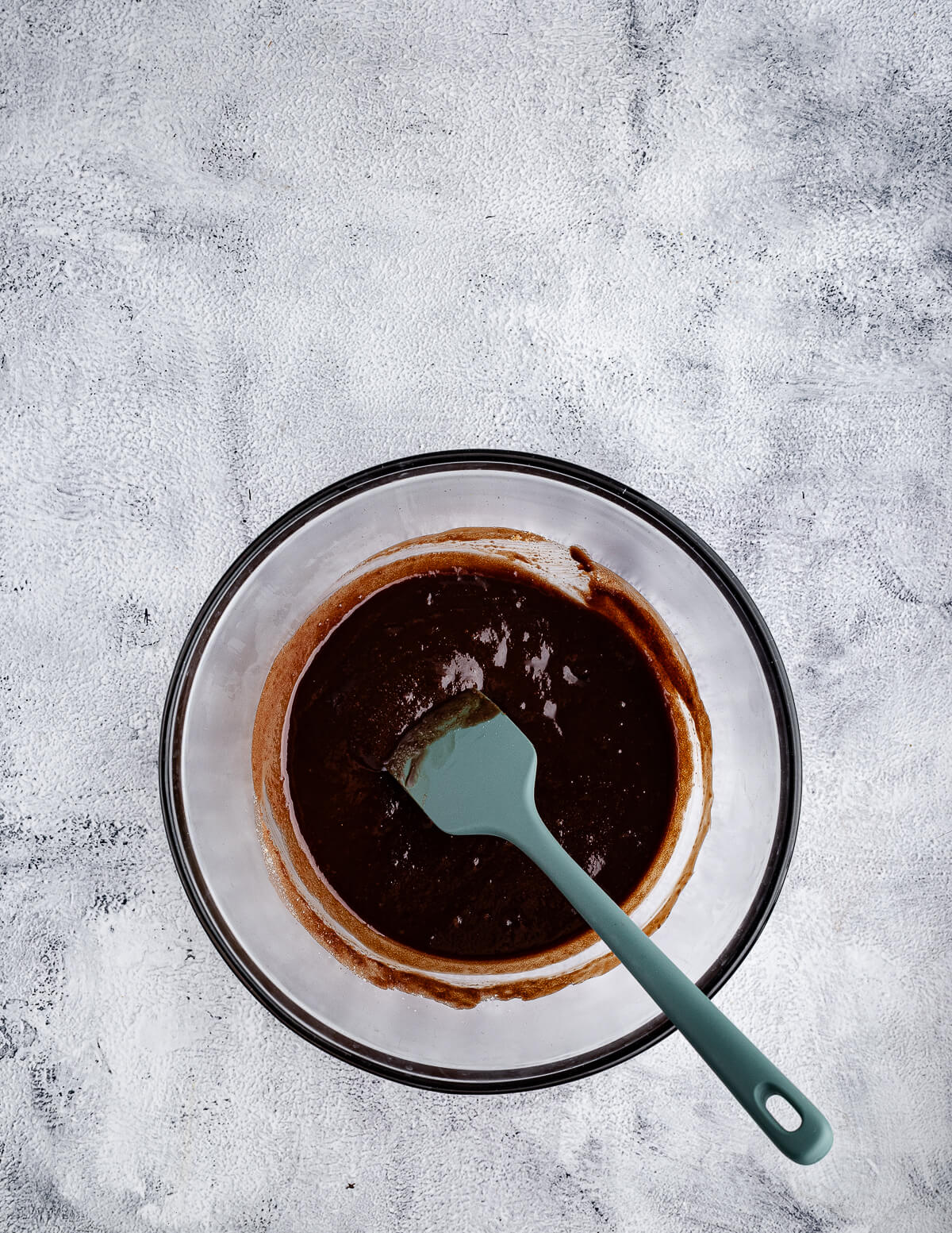 melted chocolate, sugar, and butter in a bowl.