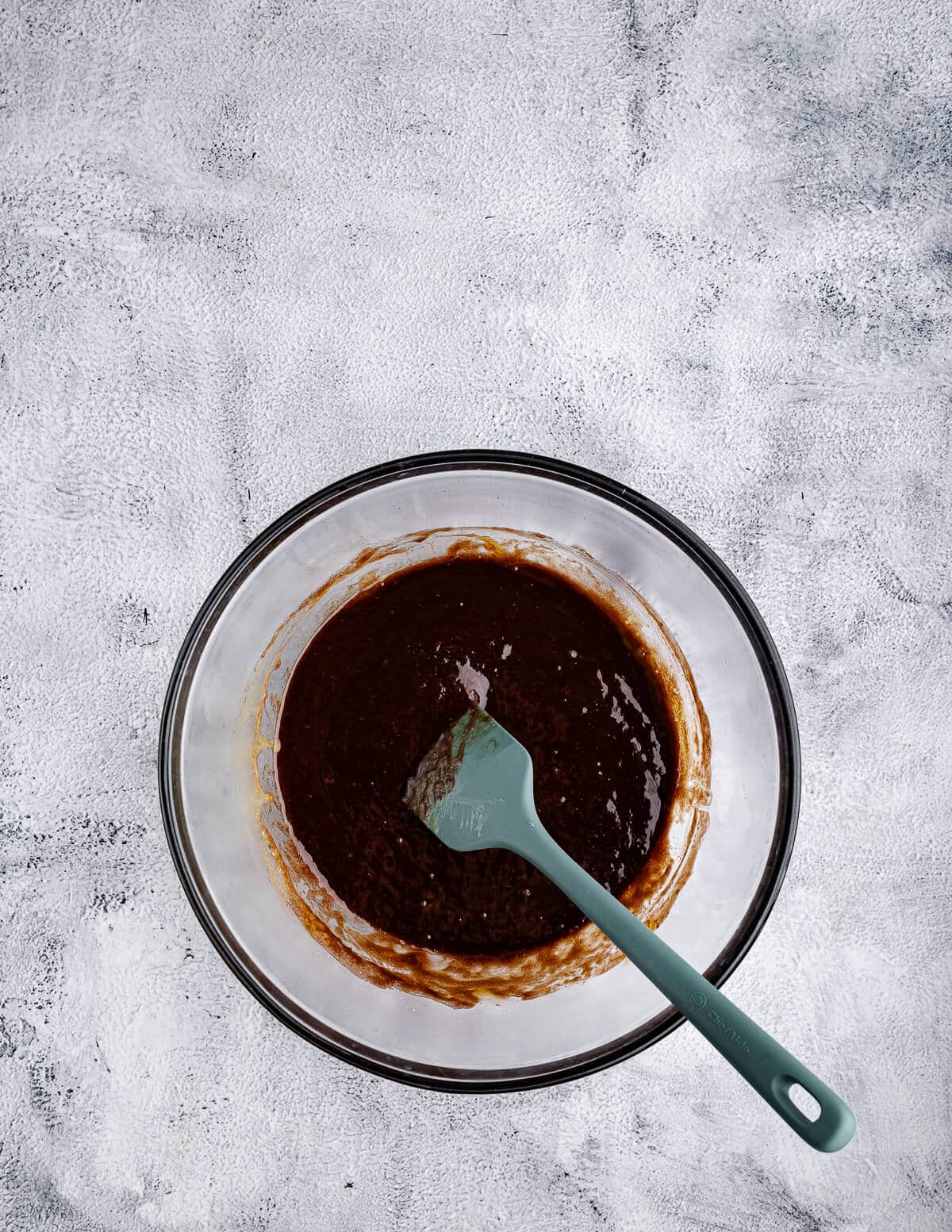 a bowl of chocolate and eggs mixed together.