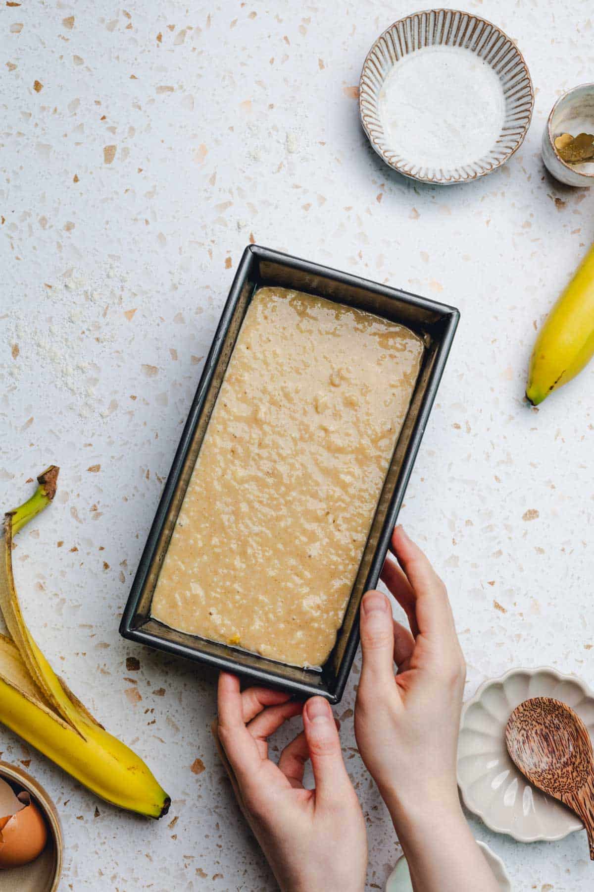 banana bread batter in a loaf pan.