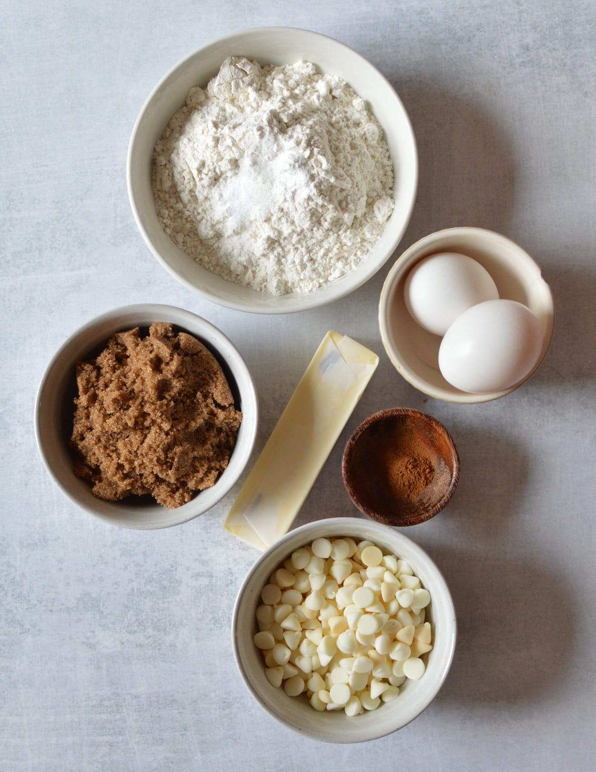 gluten-free flour, eggs, brown sugar, cinnamon, butter, white chocolate chips, baking powder, baking soda, salt, and cinnamon.