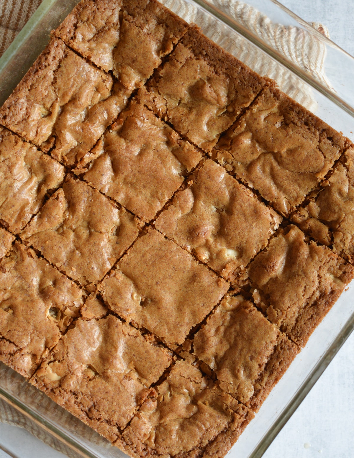 cut blondies in a baking dish.