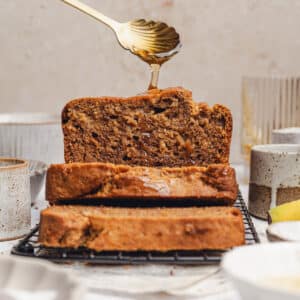 sliced banana bread with honey drizzled on top