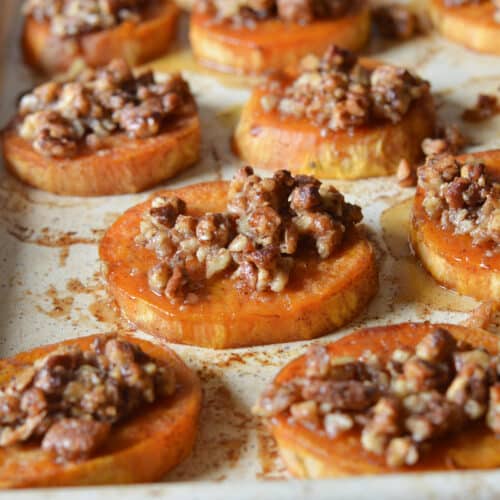 roasted sweet potato slices topped with candied pecans