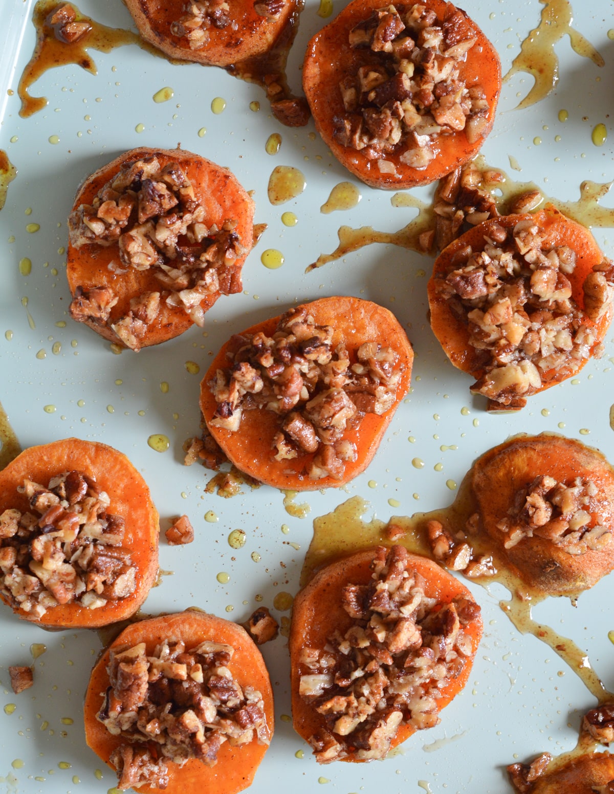 roasted sweet potatoes with pecans on top.