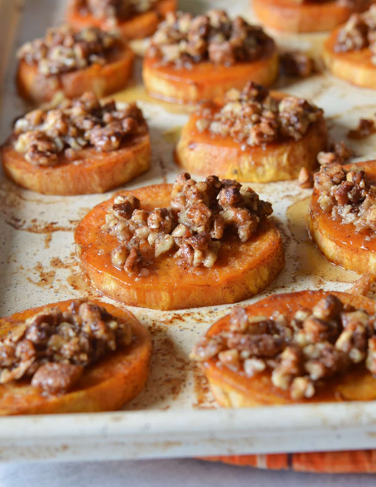 roasted sweet potato slices with candied pecans.