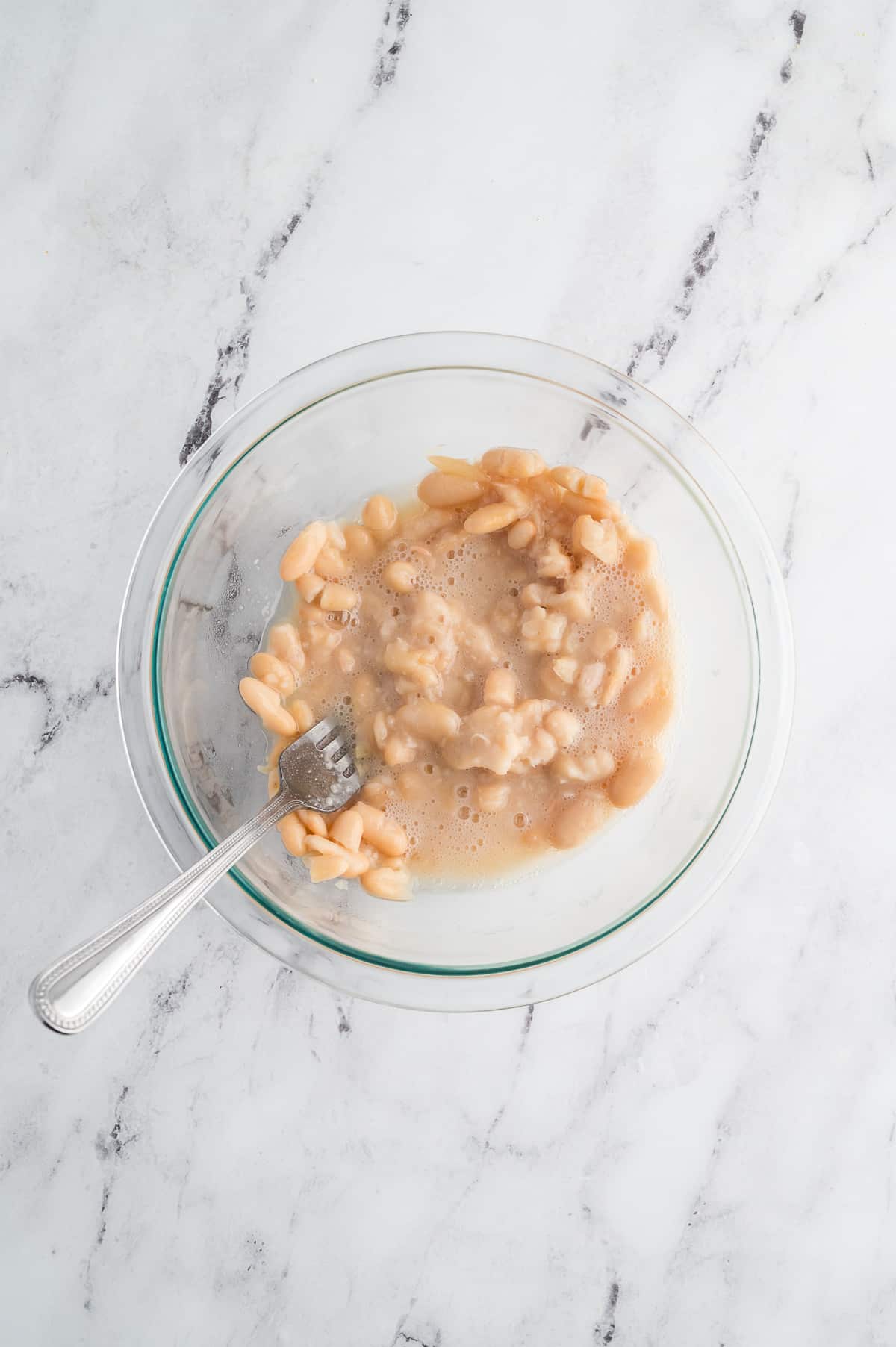 a bowl of mashed white beans.