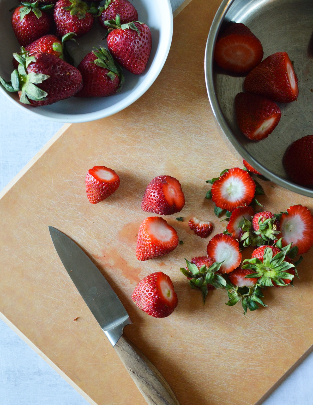strawberries on a cutting board
