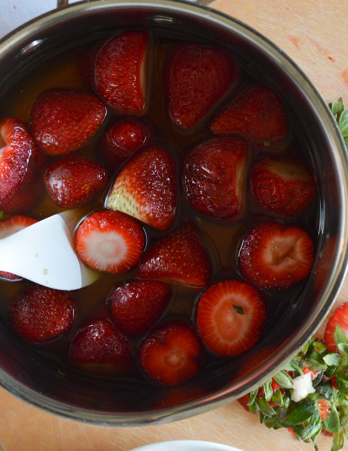 strawberries and passion fruit juice in a saucepan.