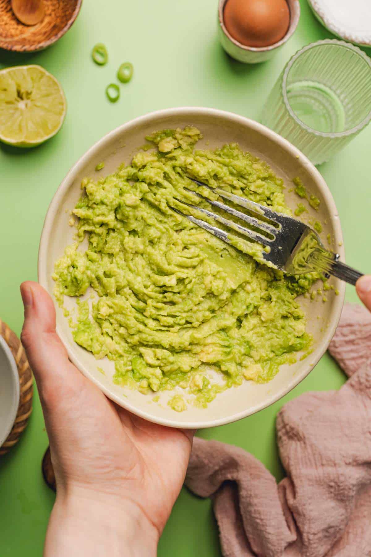 a bowl of mashed avocado