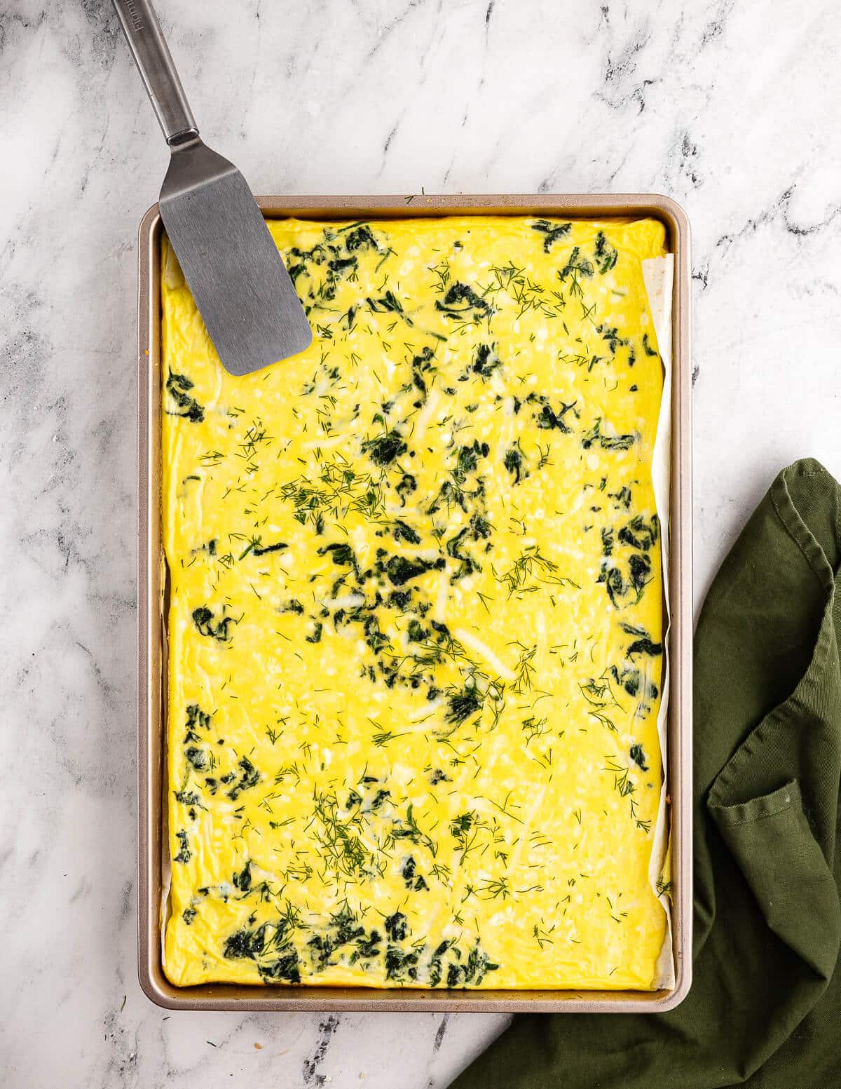 sheet pan egg bake with spinach, feta, and mozzarella.