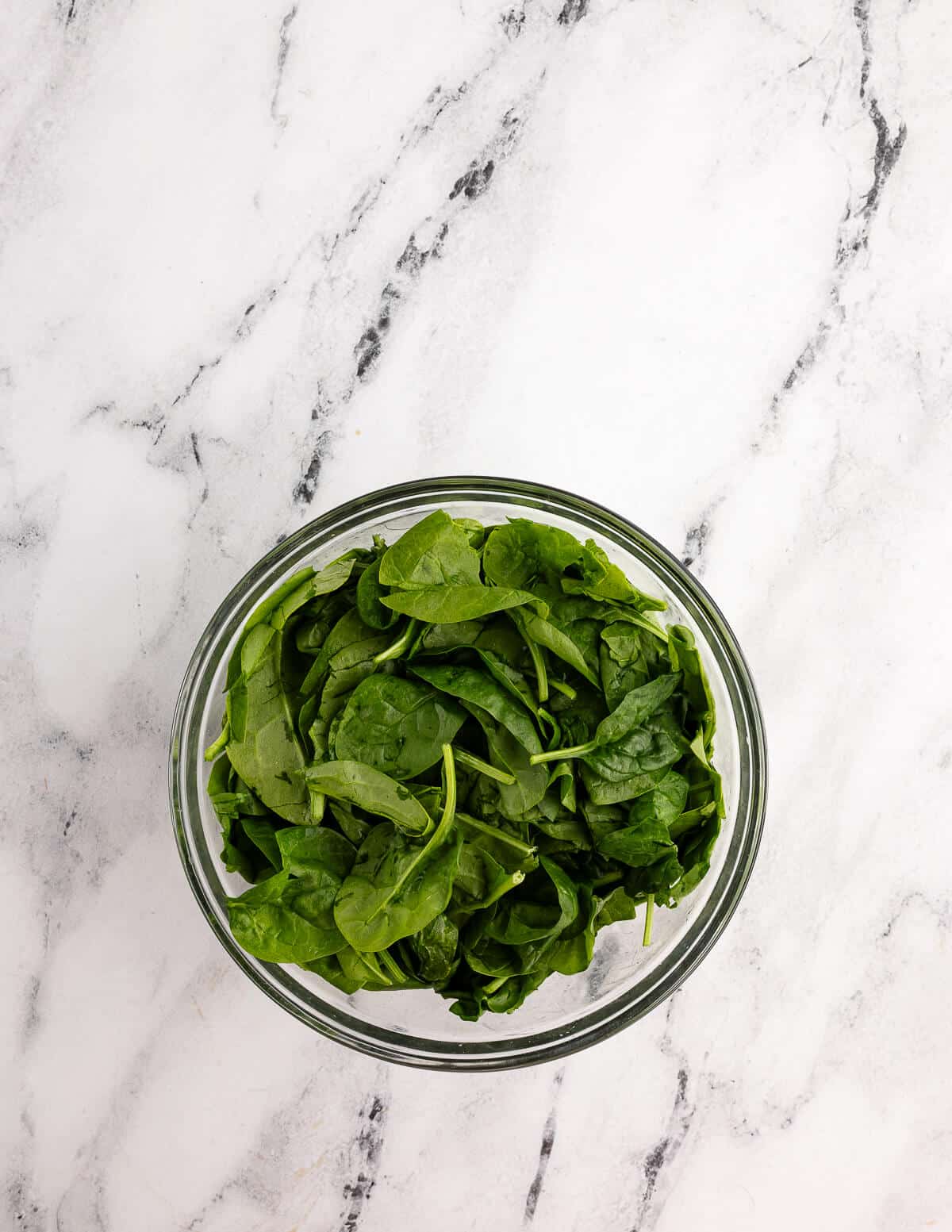 a bowl of baby spinach.
