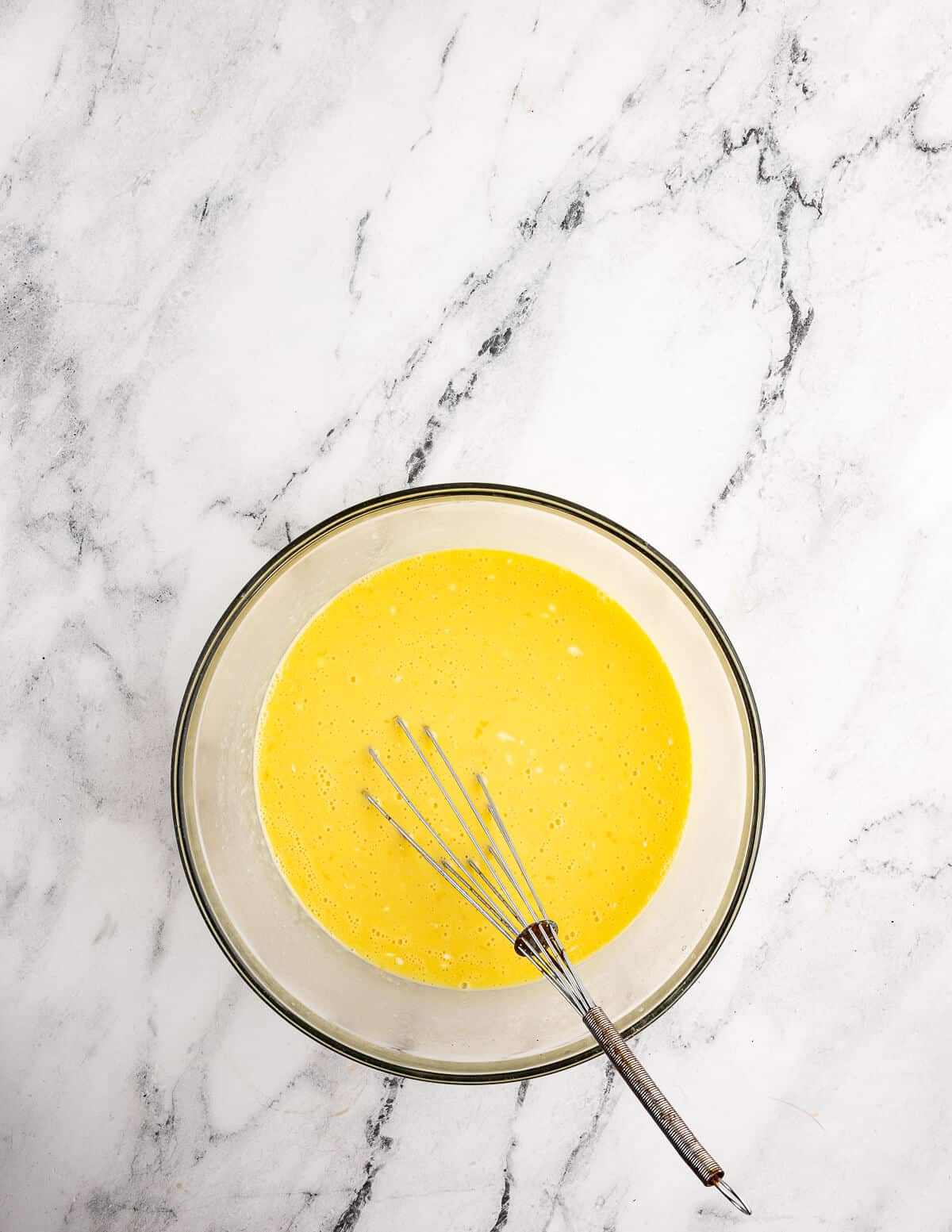 a bowl of whisked eggs.