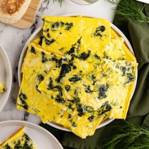 a plate of cooked eggs cut into squares