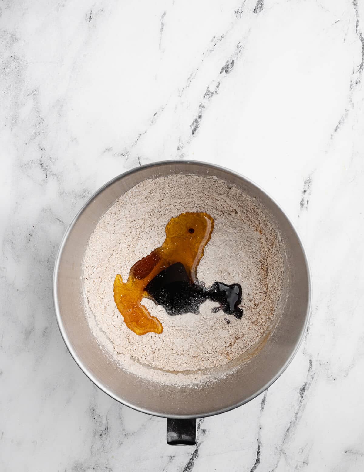 gluten-free flour, cinnamon, sugar, baking powder, honey, and molasses in a mixing bowl.