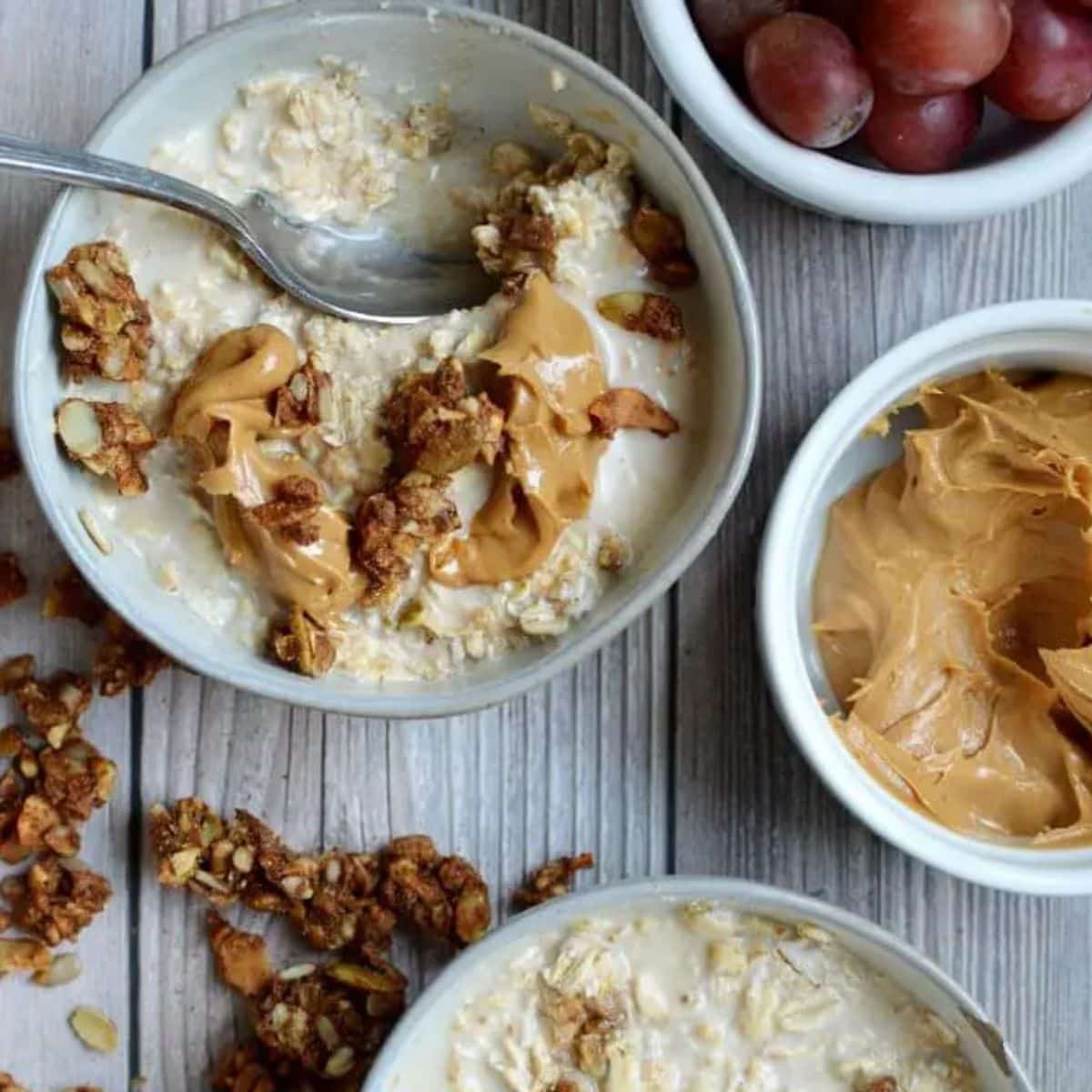 a bowl of oatmeal with peanut butter and granola on top.