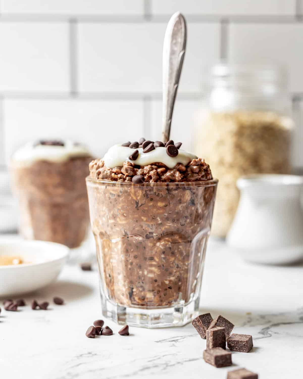 a glass filled with chocolate peanut butter overnight oats