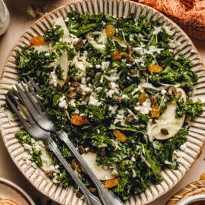 a kale salad with apples, golden raisins, and maple pepitas.