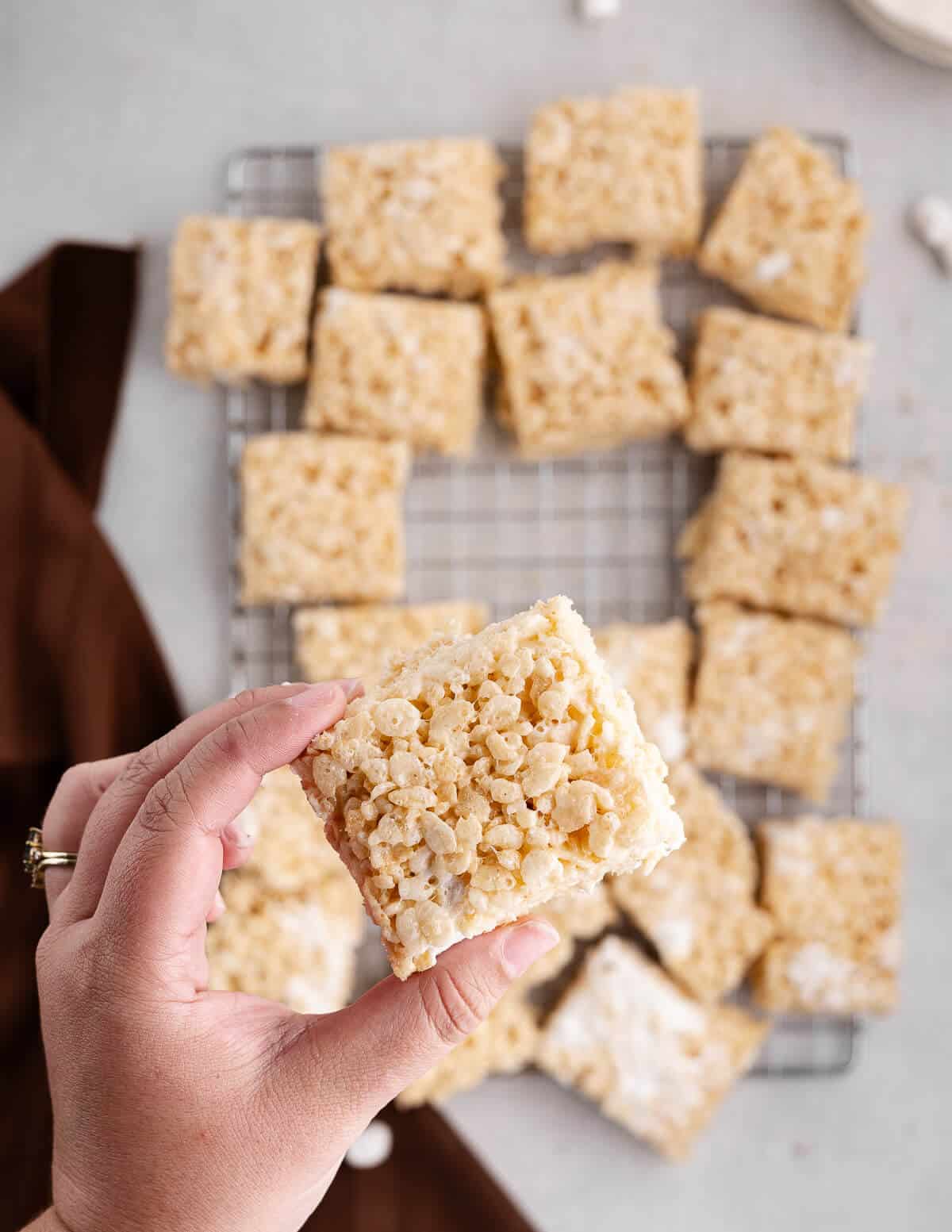 hand holding a rice krispie bar
