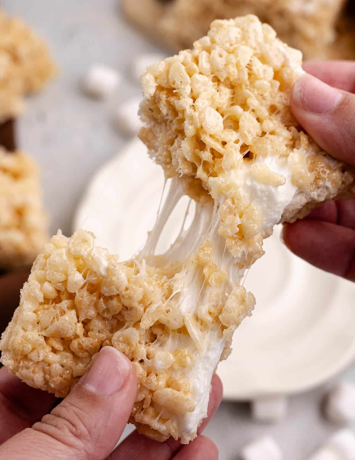 hand pulling apart a homemade rice crispy treat