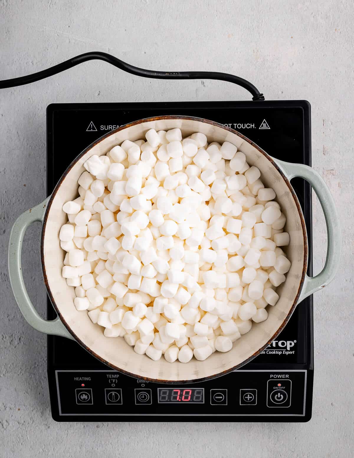 a pot with mini marshmallows in it.